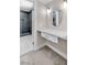 Bathroom vanity with marble countertop, oval mirror and view of updated glass shower at 4813 Plata Del Sol, Las Vegas, NV 89121