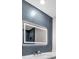 Modern bathroom with an illuminated mirror, a faucet, and contemporary finishes at 4813 Plata Del Sol, Las Vegas, NV 89121
