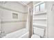 Bright bathroom featuring a shower-tub combination with tiled walls at 5012 Newport Cove Dr # C, Las Vegas, NV 89119