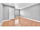 Neutral bedroom with light gray walls, wood-look flooring and a window at 5012 Newport Cove Dr # C, Las Vegas, NV 89119
