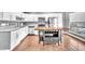 This home features a modern kitchen with white cabinets, stainless steel appliances, and a functional island at 5012 Newport Cove Dr # C, Las Vegas, NV 89119