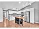 Bright kitchen features white cabinets, stainless steel appliances, and an island with wine rack at 5012 Newport Cove Dr # C, Las Vegas, NV 89119