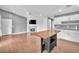 Open concept living area with fireplace and eat-in kitchen featuring a functional island at 5012 Newport Cove Dr # C, Las Vegas, NV 89119