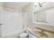 Bright bathroom features a white tile shower-tub combination and neutral vanity at 5063 Eldora Ave # 4, Las Vegas, NV 89146