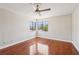Corner bedroom featuring wood laminate flooring, ceiling fan and multiple windows at 5063 Eldora Ave # 4, Las Vegas, NV 89146