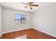 Bedroom with laminate flooring, ceiling fan, and a window provides natural light at 5063 Eldora Ave # 4, Las Vegas, NV 89146