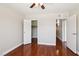 Bedroom with laminate flooring, ceiling fan, closet and view to the hallway at 5063 Eldora Ave # 4, Las Vegas, NV 89146