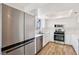 Well-lit kitchen with stainless steel appliances, white cabinetry, and bright countertops at 5063 Eldora Ave # 4, Las Vegas, NV 89146