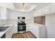 Bright, well-equipped kitchen with stainless steel appliances, white cabinets, and ample counter space at 5063 Eldora Ave # 4, Las Vegas, NV 89146