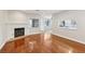 Open-concept living room with hardwood floors and a cozy fireplace at 5063 Eldora Ave # 4, Las Vegas, NV 89146