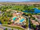 Stunning aerial view showcasing the community pool, golf course, and lush landscaping with mountain views at 5357 Eleganza Ave, Pahrump, NV 89061