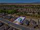 Aerial view of home with neighboring houses and golf course in the background at 5357 Eleganza Ave, Pahrump, NV 89061