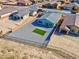Aerial view of a low maintenance backyard with a gravel ground cover and turf accents at 5357 Eleganza Ave, Pahrump, NV 89061