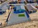 Aerial view of a low maintenance backyard with a gravel ground cover and turf accents at 5357 Eleganza Ave, Pahrump, NV 89061