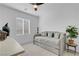 Well-lit bedroom with daybed, ceiling fan, and window at 5357 Eleganza Ave, Pahrump, NV 89061