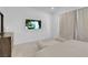 Serene bedroom with a TV, neutral decor, and soft lighting, creating a peaceful and inviting atmosphere at 5357 Eleganza Ave, Pahrump, NV 89061