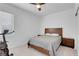 Bedroom with wood bed frame, window, and exercise equipment at 5357 Eleganza Ave, Pahrump, NV 89061