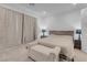 Comfortable bedroom with neutral tones, plush bedding, and soft lighting, creating a relaxing and inviting space at 5357 Eleganza Ave, Pahrump, NV 89061
