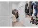 Spacious walk-in closet with dual hanging racks and shelving at 5357 Eleganza Ave, Pahrump, NV 89061
