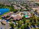 Aerial view of the community clubhouse featuring pools, patios, and mature trees at 5357 Eleganza Ave, Pahrump, NV 89061
