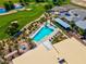Aerial view of the community pool featuring lounge chairs and sunshades at 5357 Eleganza Ave, Pahrump, NV 89061
