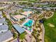 Aerial view of community pool, tennis courts, and other green spaces at 5357 Eleganza Ave, Pahrump, NV 89061