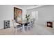 Elegant dining area with a large table, stylish chairs, and contemporary artwork at 5357 Eleganza Ave, Pahrump, NV 89061