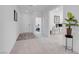 Inviting hallway with neutral colors leads to other rooms and the home's exterior entrance at 5357 Eleganza Ave, Pahrump, NV 89061