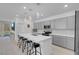 Open-concept kitchen featuring a large center island, modern appliances, and sleek cabinetry at 5357 Eleganza Ave, Pahrump, NV 89061