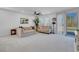 Spacious living area with a comfortable sectional sofa, bright windows, and modern decor, creating an inviting space at 5357 Eleganza Ave, Pahrump, NV 89061
