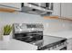 Stainless steel stovetop with microwave, stylish backsplash and modern features at 5357 Eleganza Ave, Pahrump, NV 89061