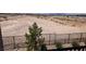 Expansive backyard with potential for landscaping and outdoor living, set against a desert backdrop at 5669 Steampunk St, Las Vegas, NV 89118