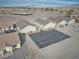 An aerial view captures several single-story homes, showing off their spacious layouts and convenient parking areas at 610 San Lorenzo St, Pahrump, NV 89048