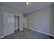 This bedroom features a closet with sliding doors and neutral walls at 610 San Lorenzo St, Pahrump, NV 89048