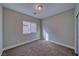 A simple bedroom with neutral colored walls and carpet at 610 San Lorenzo St, Pahrump, NV 89048