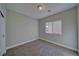 A simple bedroom with neutral colored walls and carpet at 610 San Lorenzo St, Pahrump, NV 89048