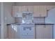 Modern kitchen with a white stove and bright cabinets at 610 San Lorenzo St, Pahrump, NV 89048