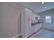 Modern kitchen with white cabinetry, granite counters, and stainless steel appliances at 610 San Lorenzo St, Pahrump, NV 89048