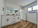 Bathroom featuring double sinks, and hardwood flooring at 6191 Bullion Blvd, Las Vegas, NV 89103