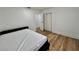 Bright bedroom features wood flooring, closet, and neutral paint, awaiting your personal touches at 6191 Bullion Blvd, Las Vegas, NV 89103
