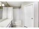 Bright bathroom featuring a tub with white subway tile surround and a white vanity at 6250 W Flamingo Rd # 43, Las Vegas, NV 89103