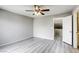 Spacious bedroom featuring wood-look floors and a ceiling fan at 6250 W Flamingo Rd # 43, Las Vegas, NV 89103