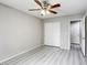 Bedroom with wood-look flooring, closet with sliding doors and access to ensuite bathroom at 6250 W Flamingo Rd # 43, Las Vegas, NV 89103