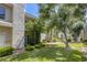 Exterior view of the building surrounded by a green lawn and mature trees at 6250 W Flamingo Rd # 43, Las Vegas, NV 89103