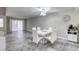 Elegant dining area with wood-look floors, modern lighting, and ample space at 6250 W Flamingo Rd # 43, Las Vegas, NV 89103