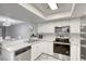 Modern kitchen with stainless steel appliances, light countertops, and white cabinets at 6250 W Flamingo Rd # 43, Las Vegas, NV 89103
