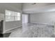 Spacious living room area with fireplace, large windows and wood-look tile flooring at 6250 W Flamingo Rd # 43, Las Vegas, NV 89103