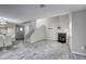 A bright living room with wood tile floors, neutral walls, and a fireplace at 6250 W Flamingo Rd # 43, Las Vegas, NV 89103