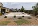 Covered pool in a large backyard with patio furniture and mature landscaping, creating a relaxing retreat at 6311 Baker Creek St, Las Vegas, NV 89149