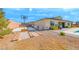 Spacious backyard featuring a basketball court and desert landscaping, perfect for outdoor activities at 6311 Baker Creek St, Las Vegas, NV 89149